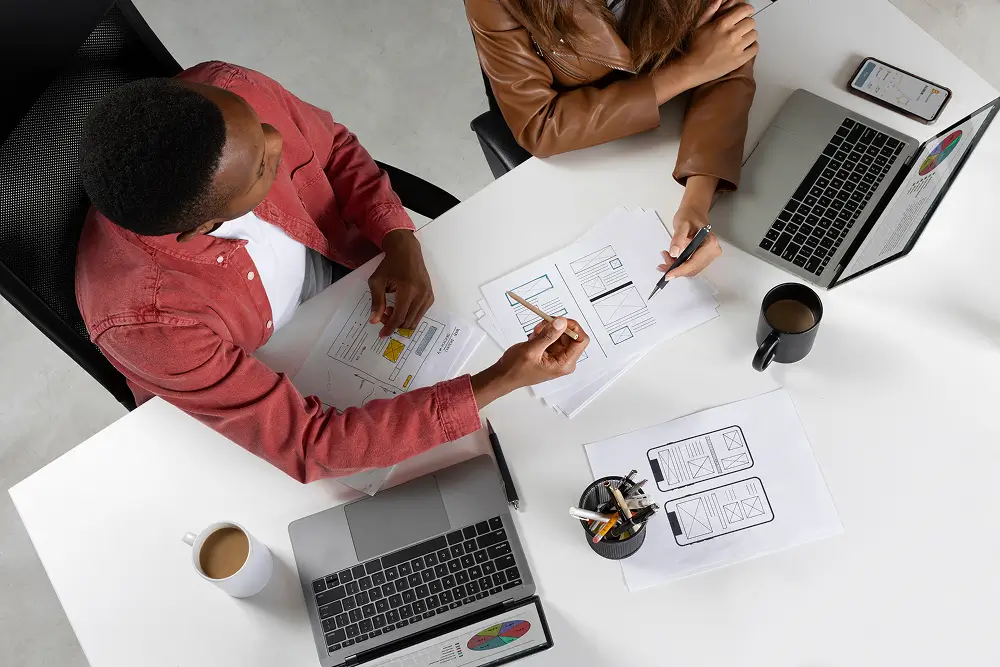 Consultation & Concept-top-view-people-working-with-laptops